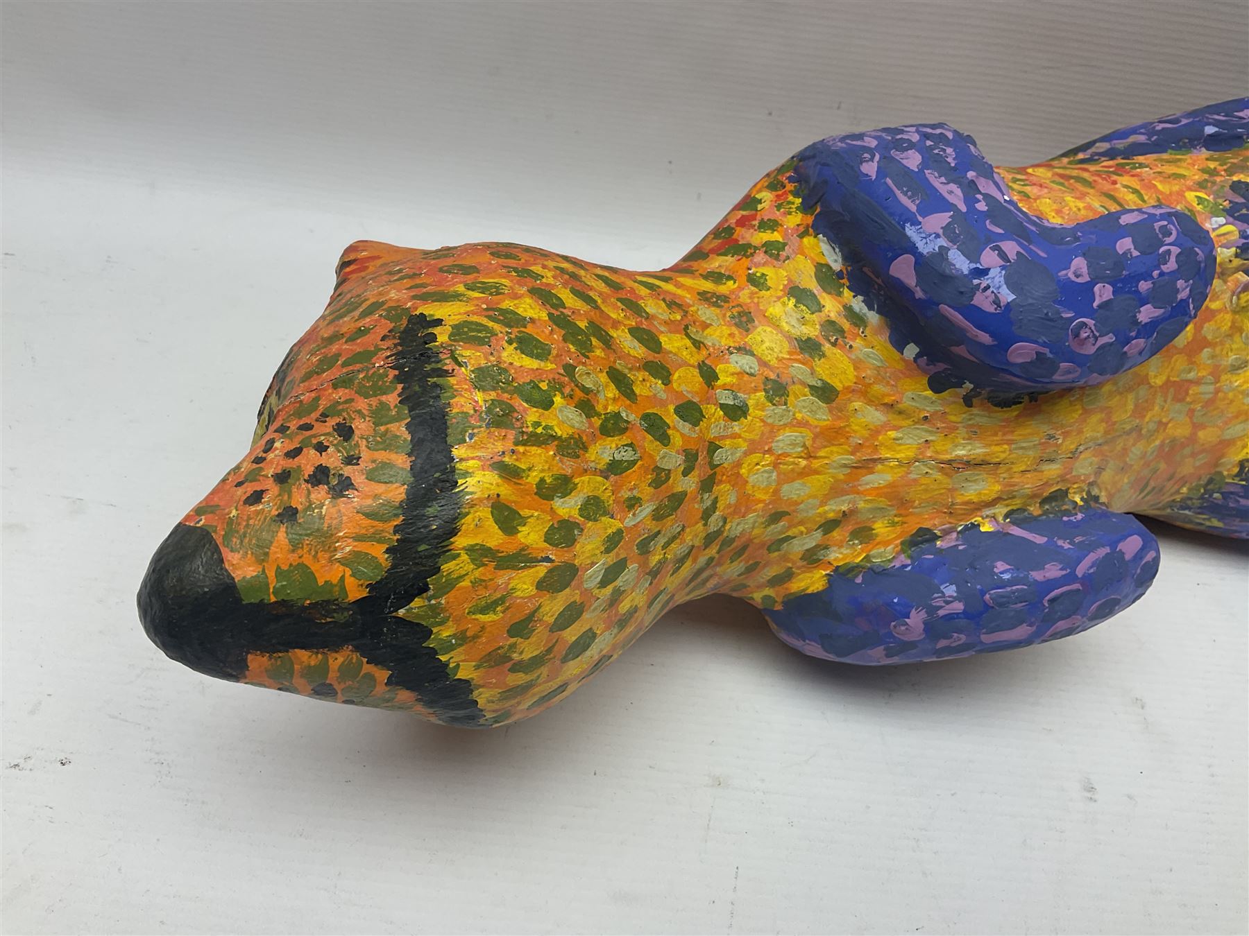 Helen Skelton (British 1933 – 2023): Two carved wooden abstract sculptures, one modelled as a dog, the other modelled as a bear, both with painted stippled decoration, largest H20cm. Born into an RAF family in 1933 in Kent and travelled the world extensively during her childhood. After settling in Bridlington, Helen immersed herself in painting, textiles, and wood sculpture, often inspired by nature's beauty. Her talent was showcased in a one-woman show at Sewerby Hall and recognised with the sculpture prize at Ferens Art Gallery in 2000. Sadly, Helen’s daughter passed away from cancer in 2005. This loss inspired Helen to donate her sculptures to Marie Curie upon her passing in 2023.