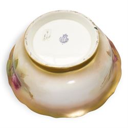 1920s Royal Worcester porcelain rose bowl, the flattened baluster body hand painted with roses and foliage, below a flared gilt pierced border, raised upon scroll moulded quatrefoil foot, shape no. H166, H13cm, together with a similarly decorated Royal Worcester bowl (2)