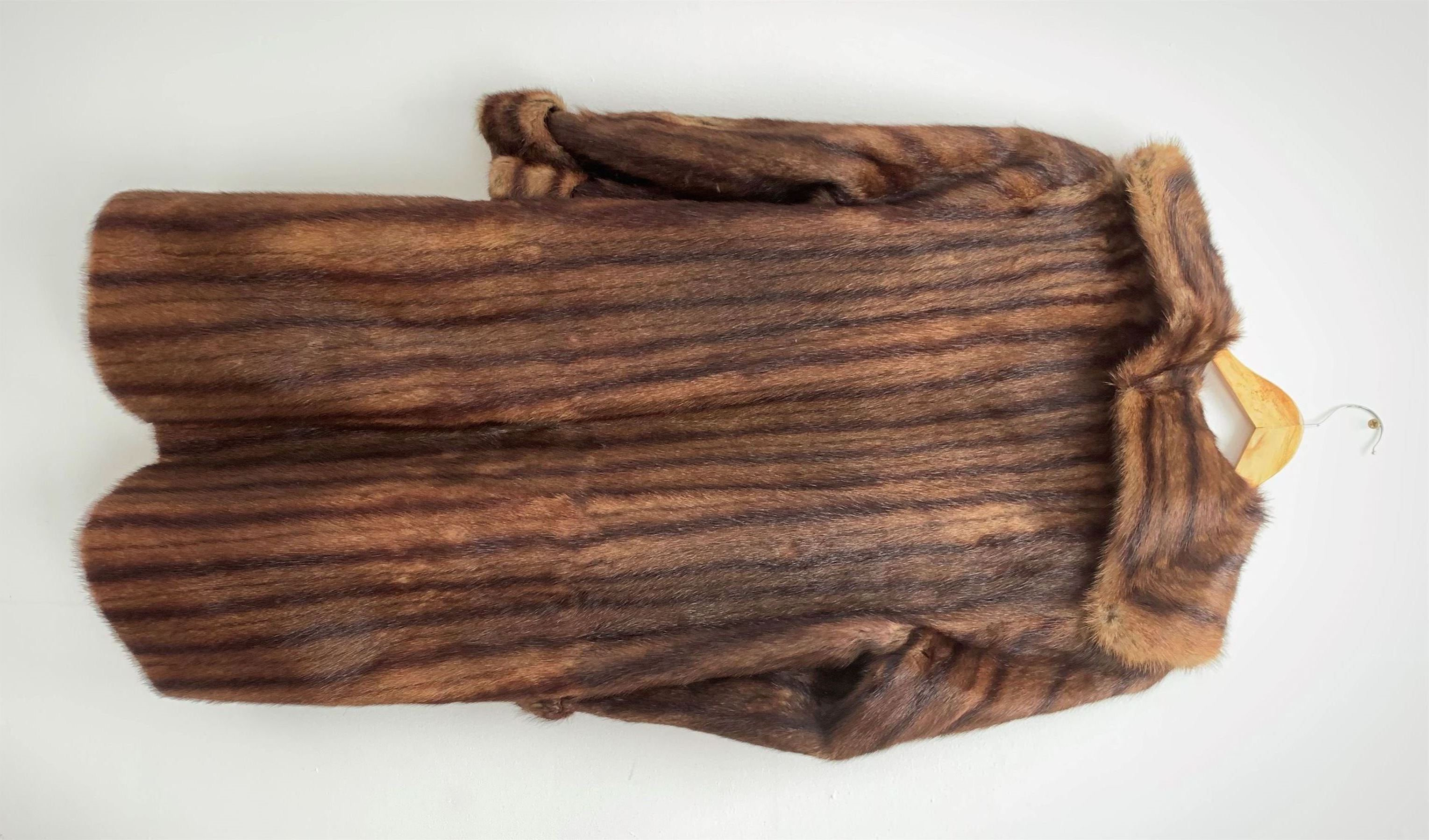 A lined Musquash fur coat. 