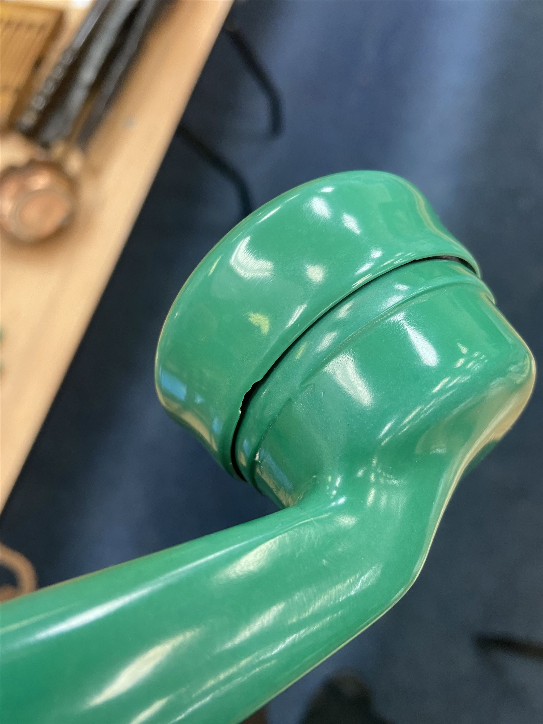 Jade green Bakelite telephone, of pyramid form with alphabet dial, brown braided handset cord and a base draw