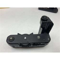 Nikon F3T camera body, in champagne/ titanium colourway, serial no. T8215031, with 'Nikon Nikkor 50mm 1:1.4' lens, Nikon MD4 motor drive, serial no. 156592 and Nikon MK-1 Firing range converter, all with original boxes 