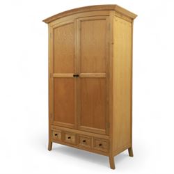 Contemporary oak double wardrobe, with fitted hanging rail above two drawers, raised on splayed feet