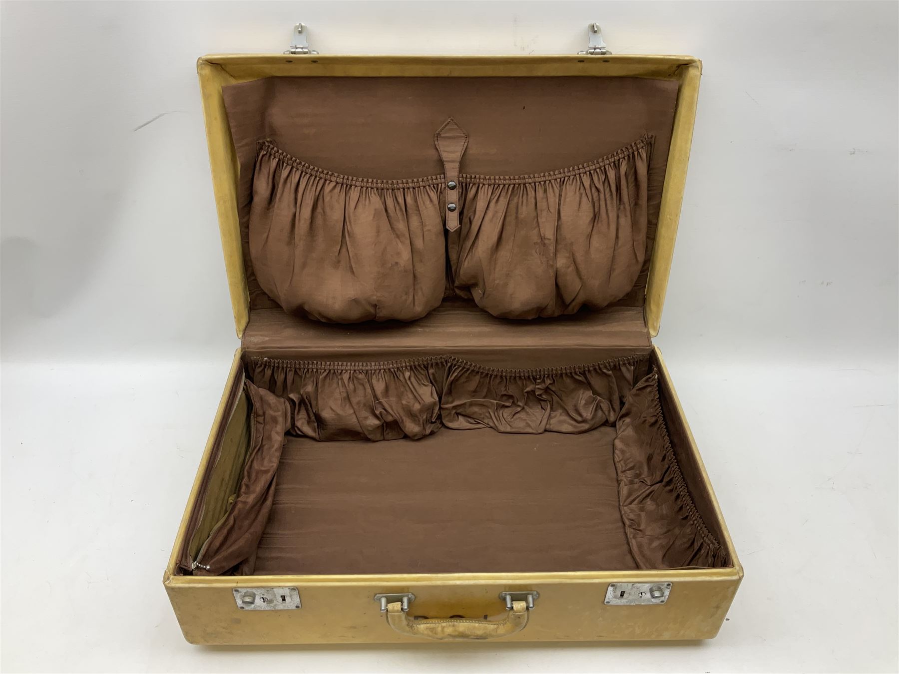 Vintage leather traveling case with monogram to cover, with watered silk lining to interior, and some contents, plus a further vintage travel case, (2)