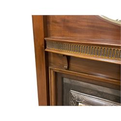 Early to mid-20th century mahogany fire surround, stepped arched top with oval bevelled mirror, fitted with shelf with fluted frieze, together with an early to mid-20th century metal fire inset with tiled uprights