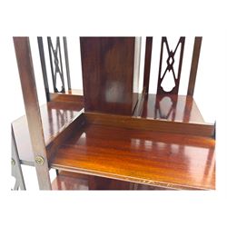 Edwardian inlaid mahogany revolving bookcase, shaped square moulded top with central motif and satinwood band, two tiers with pierced vertical splats, on swivel action base with ceramic castors