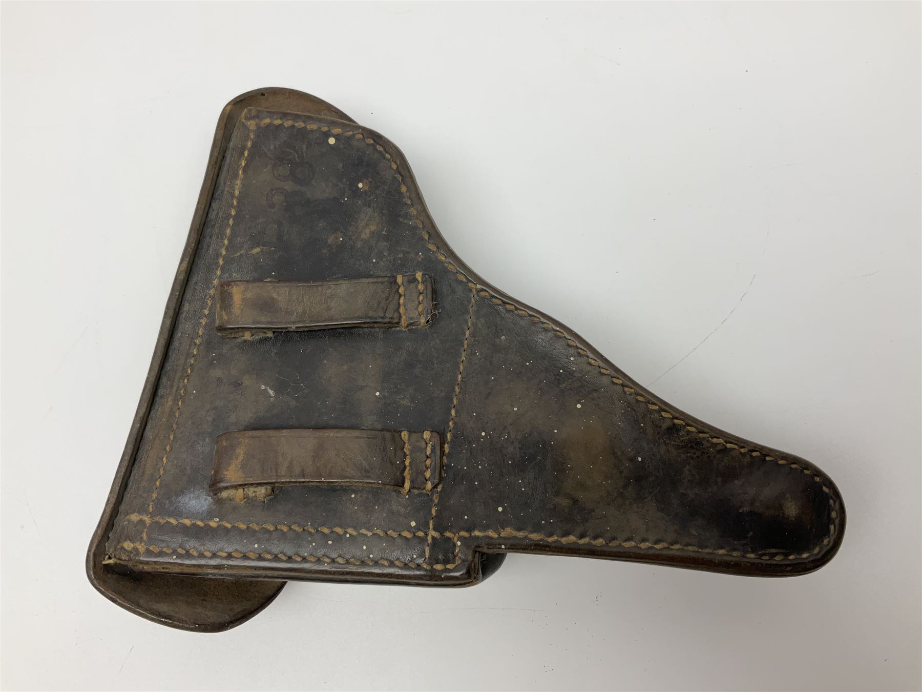 WWII German brown leather holster with side magazine pouch for a Walther P.38 semi-automatic pistol, stamped P38 and OWX 1941 on back L24.5cm