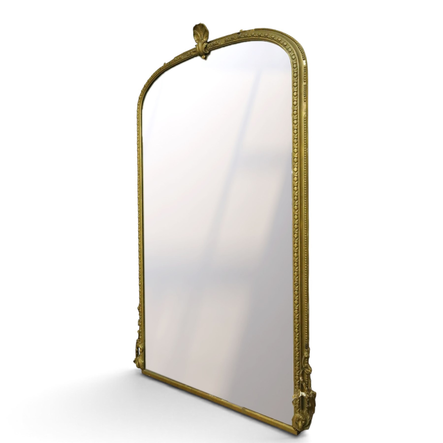 Large Country House late 19th century gilt framed overmantel mirror of arched form, the cartouche and scallop shell pediment over an egg-and-dart and beaded frame, the lower spandrels of scrolling foliate form with acanthus and flower head motifs