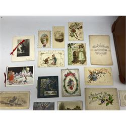 Quantity of Victorian and later postcards and greeting cards, to include Valentine's cards, paper laced, cut card work, chromolithograph and moveable examples, together with photographic examples and silk bookmarks, housed in a case
