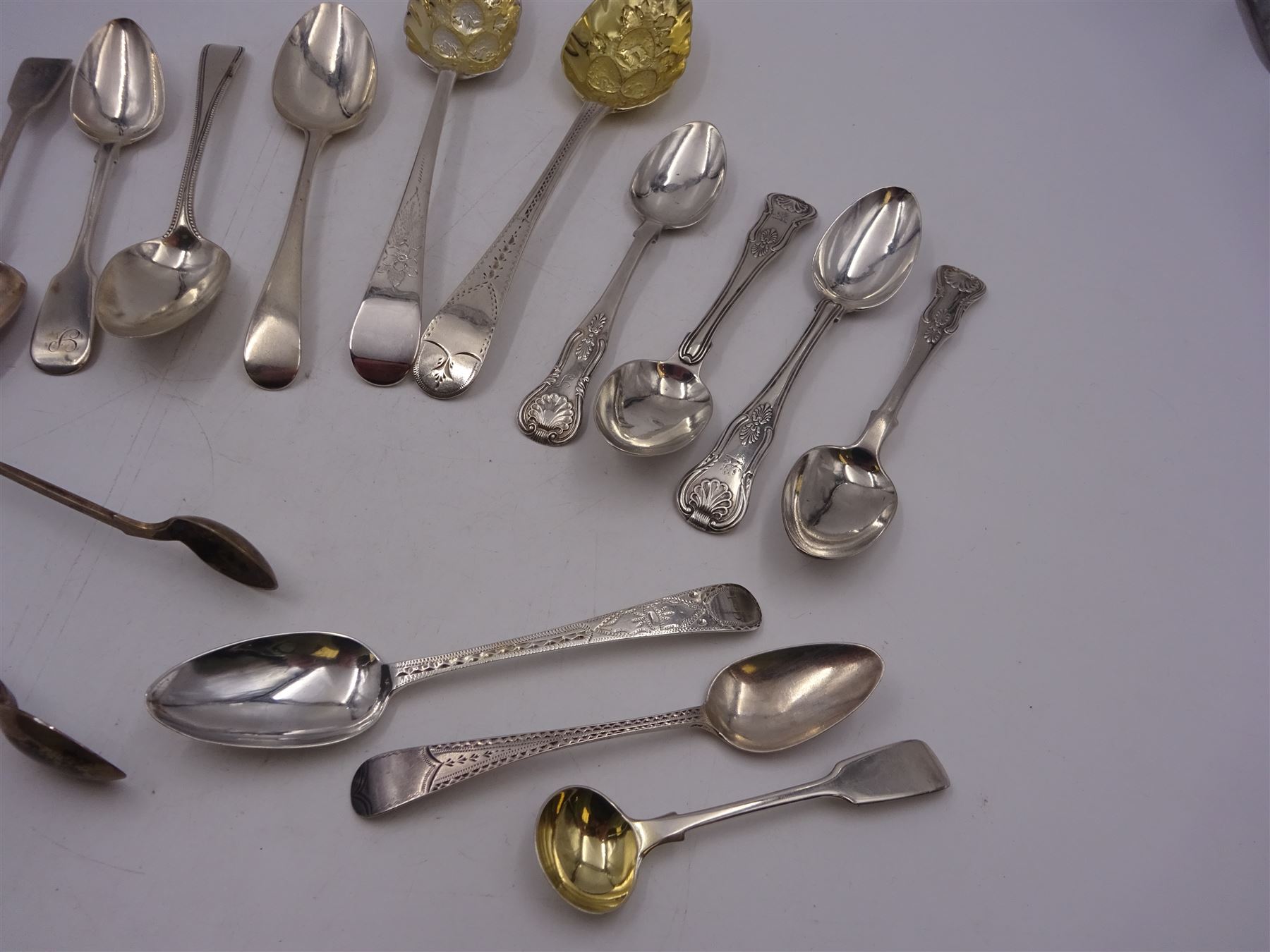 Georgian and later flatware, including two serving spoons, with later struck berry bowls, King's pattern teaspoons, mustard spoons, etc, all hallmarked 