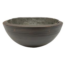 19th century pole lathe turned sycamore bowl, the interior housing lead liner, the exterior decorated with bands of deep grooves, D28cm
