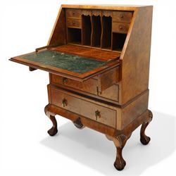 Early 20th century Queen Anne design figured walnut bureau, fall-front enclosing fitted interior, over three graduating cock-beaded drawers, shaped apron with moulded scallop shell motifs, over cabriole supports with ball-and-claw feet