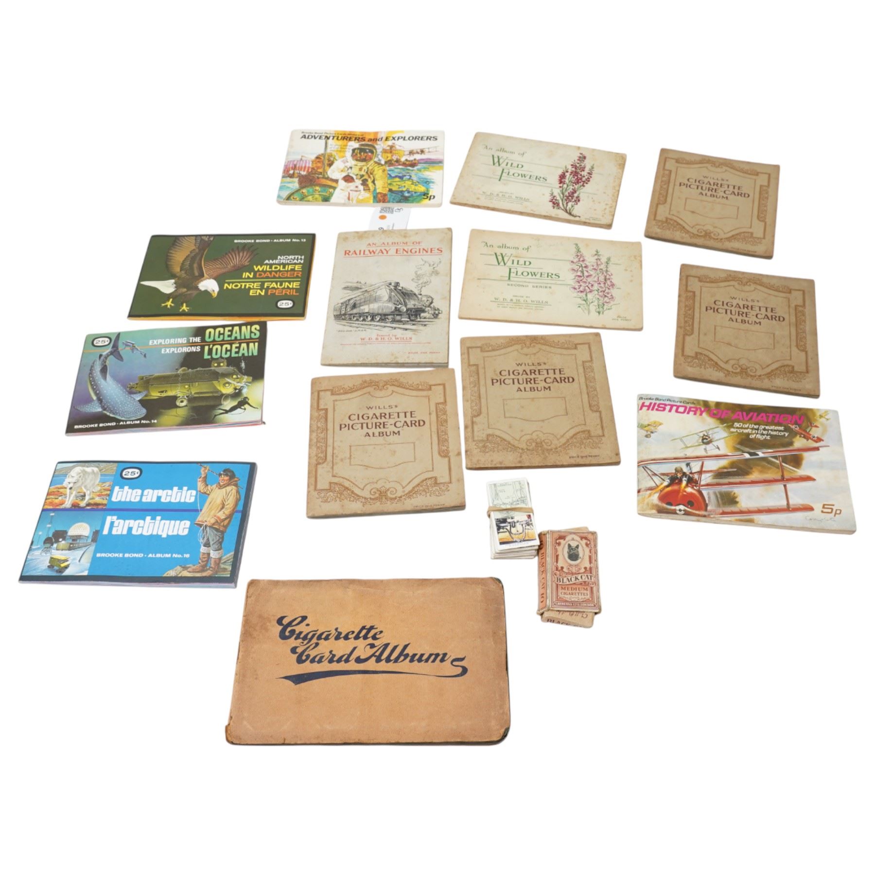 Seven albums of Wills cigarette cards including Wild Flowers, Railway Engines etc., Carreras Birds of the Countryside and five trade card albums