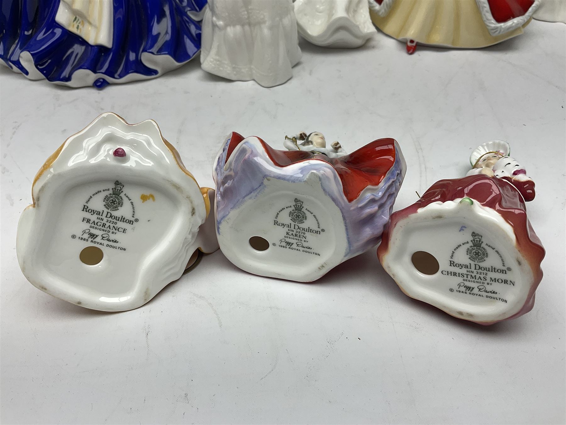 Seven Royal Doulton figures, comprising Sara HN2265, Lorraine HN4301, Mary HN3375, Olivia HN5114, Charlotte HN4092, Josephine HN4223 and Rachel HN4780, together with five smaller Royal Doulton figures (12)