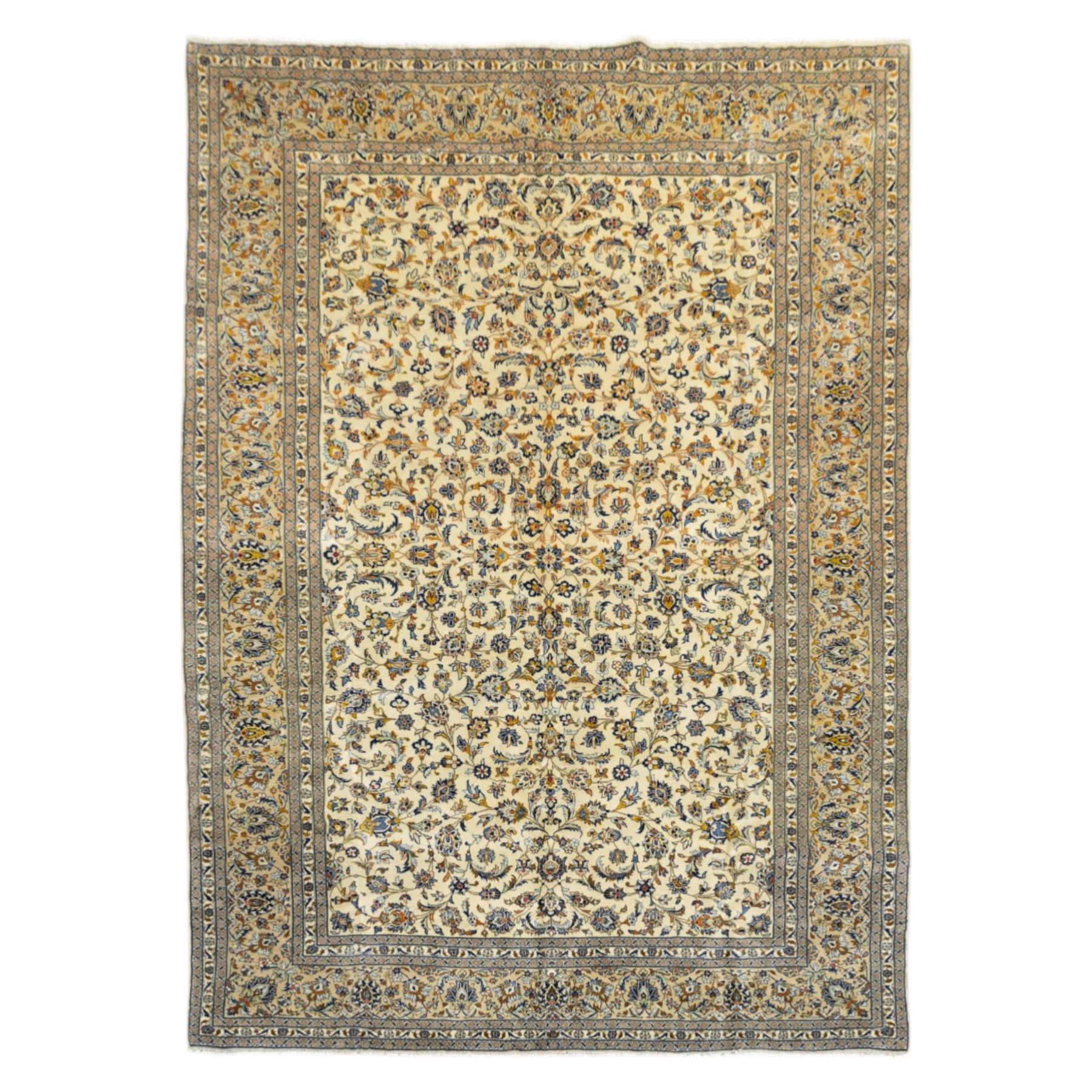 Central Persian Ardakan hand-knotted carpet, ivory field finely decorated with a symmetrical lattice of scrolling vines palmettes and flowering sprays arranged around a delicate central medallion enclosed by a pale border of stylized floral and vine ornament between multiple guard stripes with cotton fringe ends 