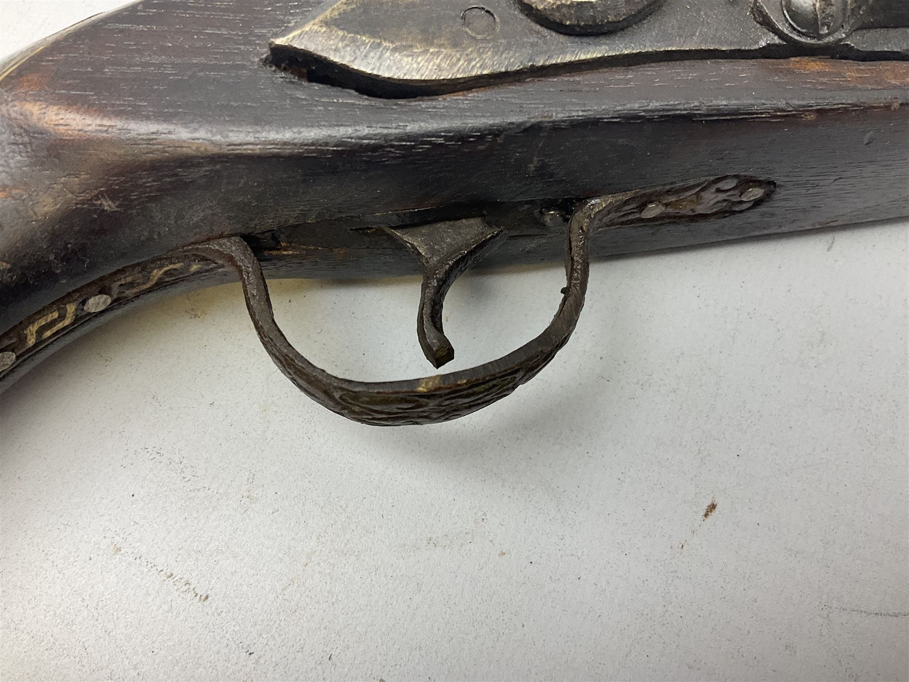 Reproduction flintlock pistol, the full walnut stock with brass filigree inlay and mounts and skull crusher butt L46cm; no visible proof marks FIREARMS CERTIFICATE REQUIRED OR RFD