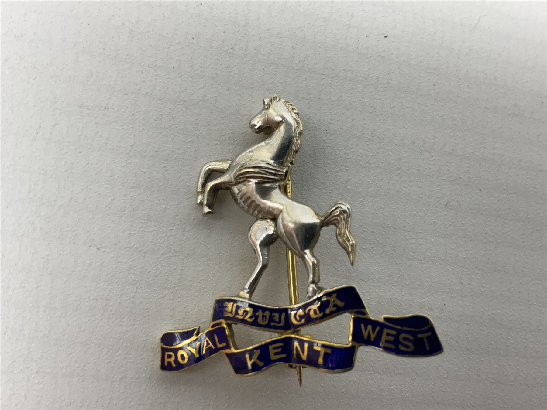 Royal West Kent regiment 9ct gold and enamel sweetheart brooch; The Queens Own regiment silver and enamel sweetheart brooch; and another sweetheart brooch for the Royal West Kent regiment (3)