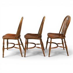 Set of six elm Windsor chairs, saddle seats with crinoline stretchers
