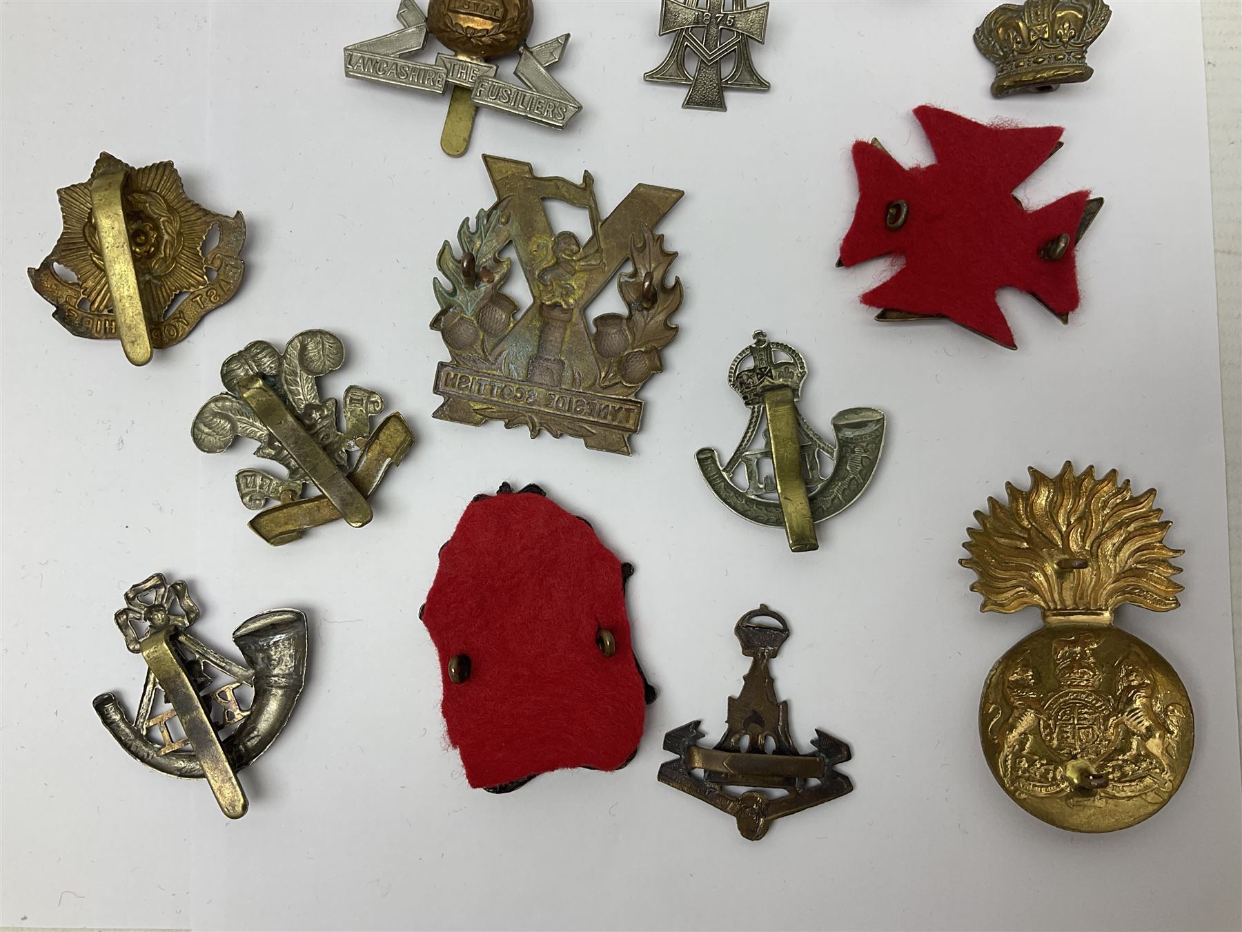 Over thirty regimental cap badges for fusiliers, Yorkshire interest, Light Infantry etc including Royal Scots and Welsh fusiliers, Durham L.I., KO Yorkshire L.I., Oxford & Bucks L.I., Green Howards, East Yorkshire, West Riding, York North Riding etc 
