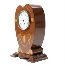 Edwardian- 8-day heart-shaped mahogany bedside table clock with decorative contrasting inlay c1905, white enamel dial with Arabic numerals, minute markers and steel spade hands, French timepiece movement with a later replacement lever platform escapement, wound and set from the rear. With key. 