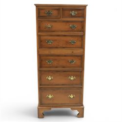 Georgian design yew wood pedestal chest, fitted with seven drawers and slide, brass drop handles