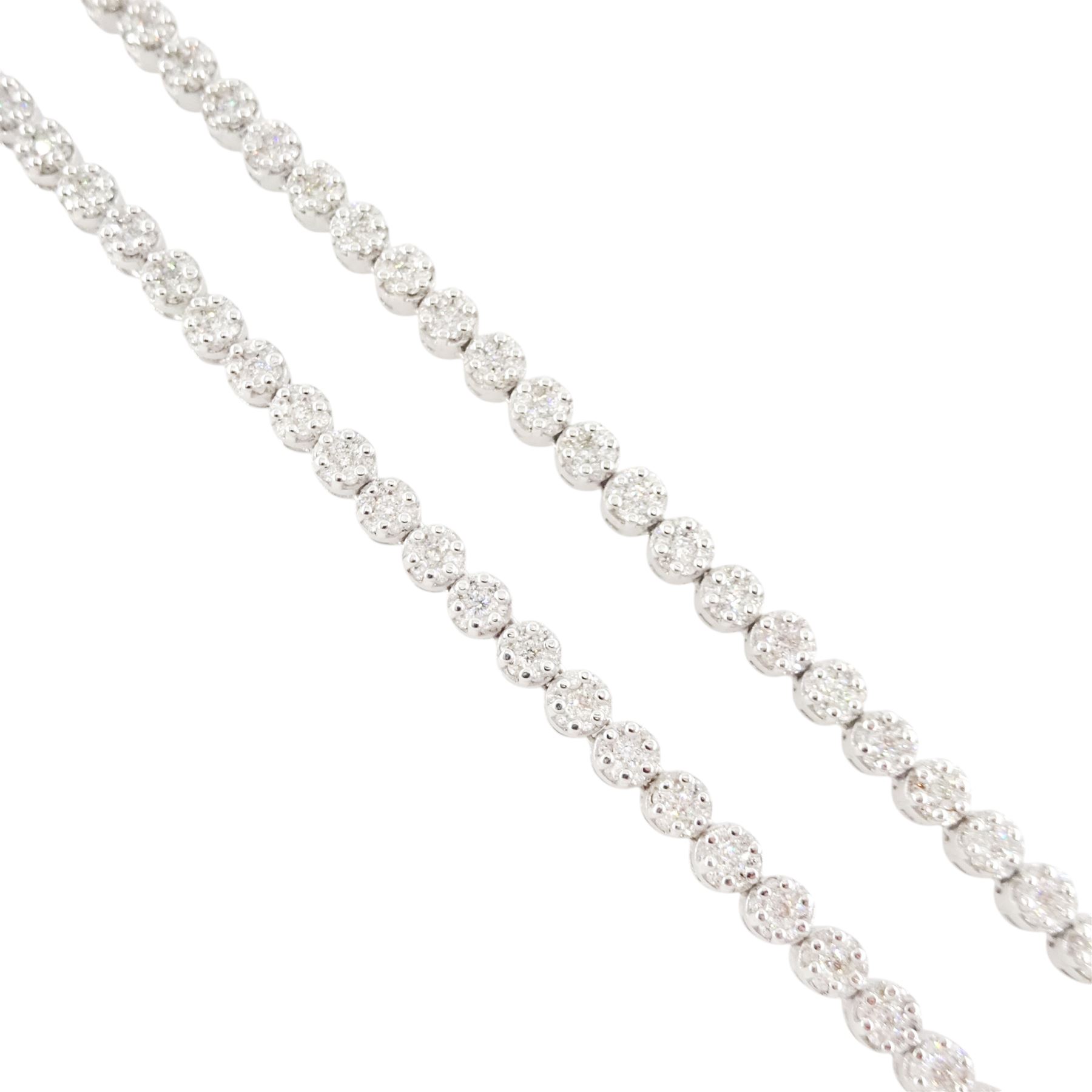 18ct gold diamond necklace, one hundred fourteen clusters, each set with seven round brilliant cut diamonds, hallmarked, total diamond weight 5.00 carat, boxed with certificate