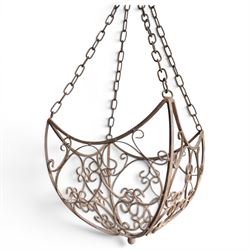 Three wrought iron garden basket planters, comprising a circular pierced and scrolling basket on tall tripod stand with scrolling supports (W31cm H76cm), and a pair of matching hanging baskets (W37cm H30cm)