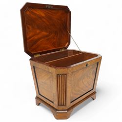 Early 19th century mahogany cellarette, tapering canted rectangular form, the hinged faceted top enclosing fitted interior, panelled front, back and sides with figured mahogany veneers, the canted corner with wide reeded decoration, on canted bracket feet 