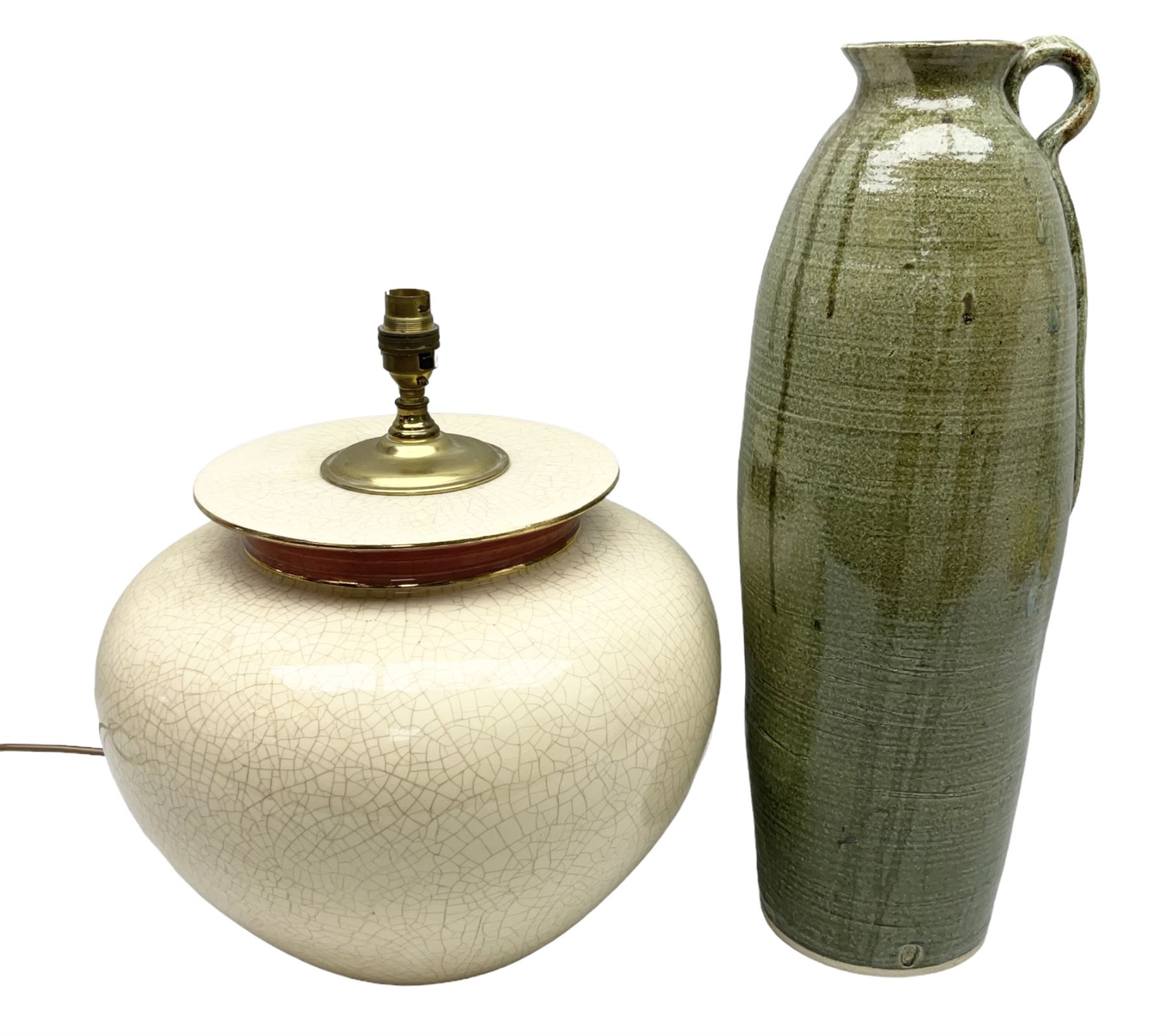 Large cream crackle glaze table lamp, together with a tall studio pottery vase in green with single loop handle, with impressed makers mark, H49cm