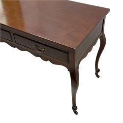 Late Victorian mahogany side table, rectangular top over two drawers and shaped apron, on cabriole supports with brass and ceramic castors