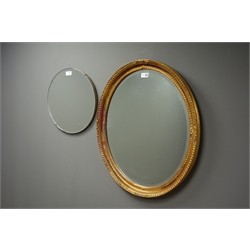  Modern oval gilt framed bevel edged mirror, rectangular wall mirror in gilt and black frame, small frameless mirror and another mirror  