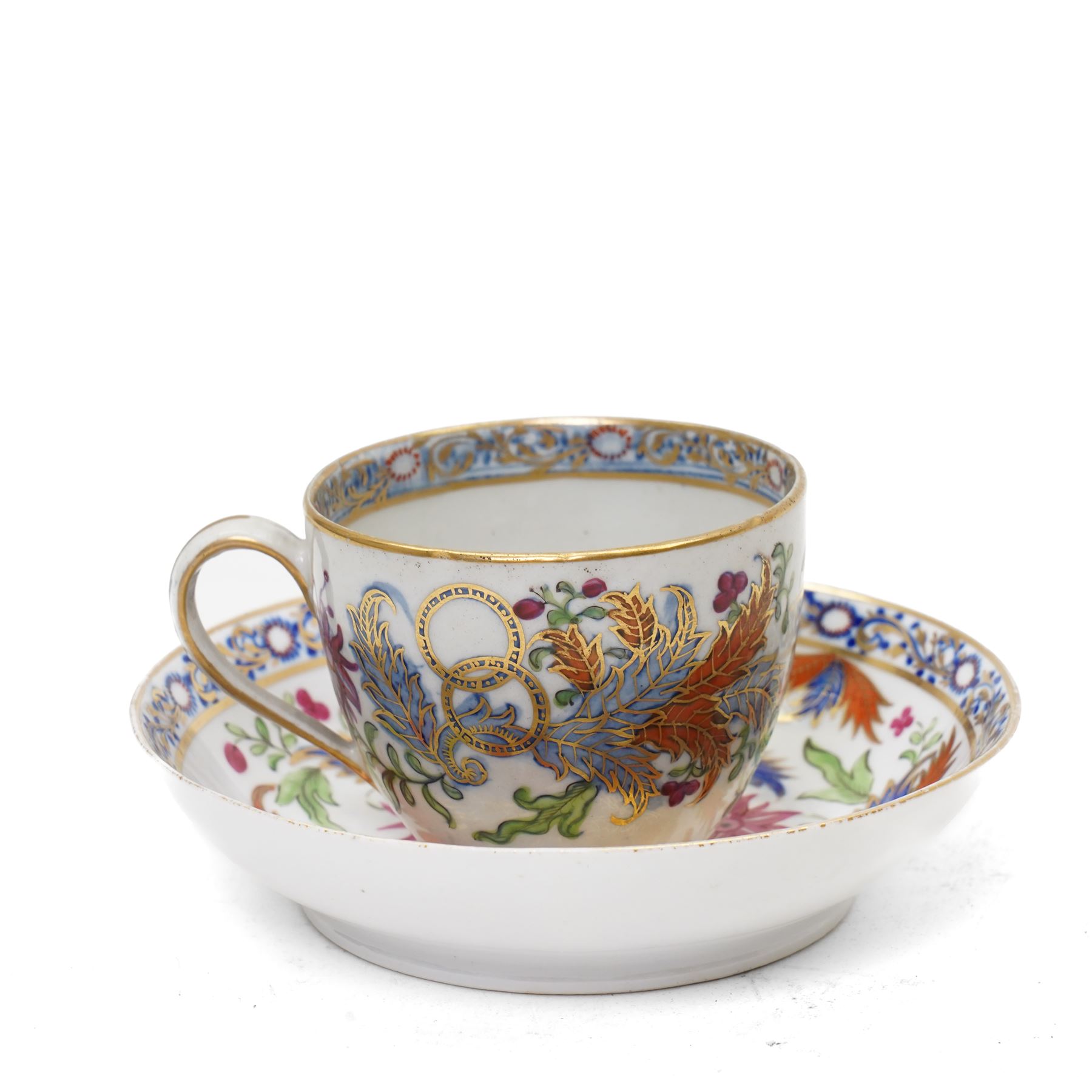 New Hall part tea and coffee service richly decorated  with a Tobacco Leaf design in pattern 274 comprising nine tea cups, eight coffee cans, ten saucers, tea pot and stand, sucrier and cover, slop bowl, milk jug and plate, circa 1800