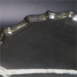 Early 20th century large silver salver, of circular form with Chippendale style rim, upon four hoof feet, hallmarked Elkington & Co Ltd, Birmingham 1918, D47cm