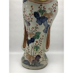 Large Japanese Imari porcelain figure, modelled as a Bijin, wearing a long kimono decorated with apple blossom and leafy branches on a white ground, with gilt detailing, possibly Edo period, H63cm