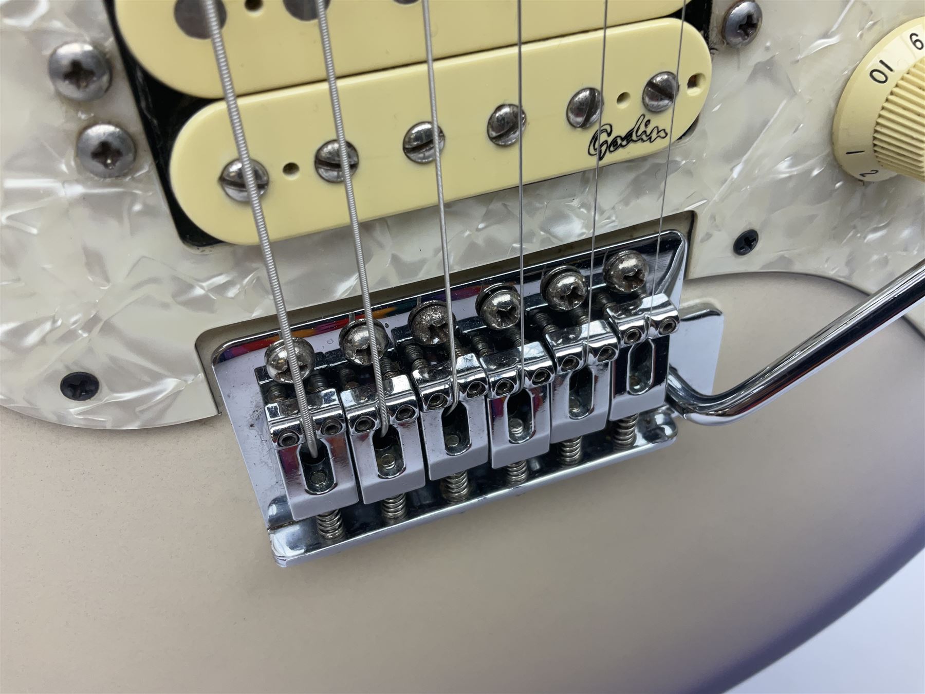 Canadian Godin SD electric guitar in two-tone purple/white with bird's eye maple neck and tremolo, serial no.98455463, L100cm overall; in soft carrying case.