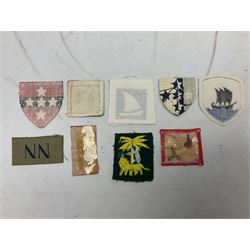 Approximately one-hundred printed and embroidered cloth badges including Royal Tank Regiment, Royal Armoured Corps, 219th Independent Infantry Brigade, Cyrenaica, Cyprus, Singapore and other districts, Gibraltar Garrison, East Anglian Brigade, 20th Armoured Brigade and various armoured divisions etc