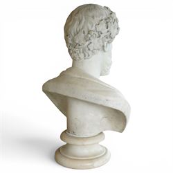 Aristide Louis Fontana (Italian 1834-1907): Grand Tour marble bust of a Roman emperor, probably inspired by portraits of Marcus Aurelius, portrayed with finely carved curled hair and beard beneath a grapevine wreath with trailing vine leaves and clusters of fruit, the draped shoulders and truncated chest raised upon a turned circular socle, signed to the reverse, H61cm; together with the associated faux marble pedestal of rectangular form, H94cm
Provenance: Kirkham Hall