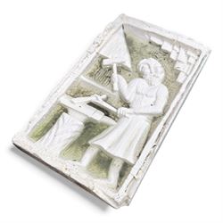 Collection of cast stone garden objects including mill stone, trough, planter, and faces