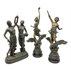 Pair of spelter figures, comprising male and female both stood upon an eagle, on stepped circular bases, together with composite sculpture of two females holding a cup between them, tallest example 64cm