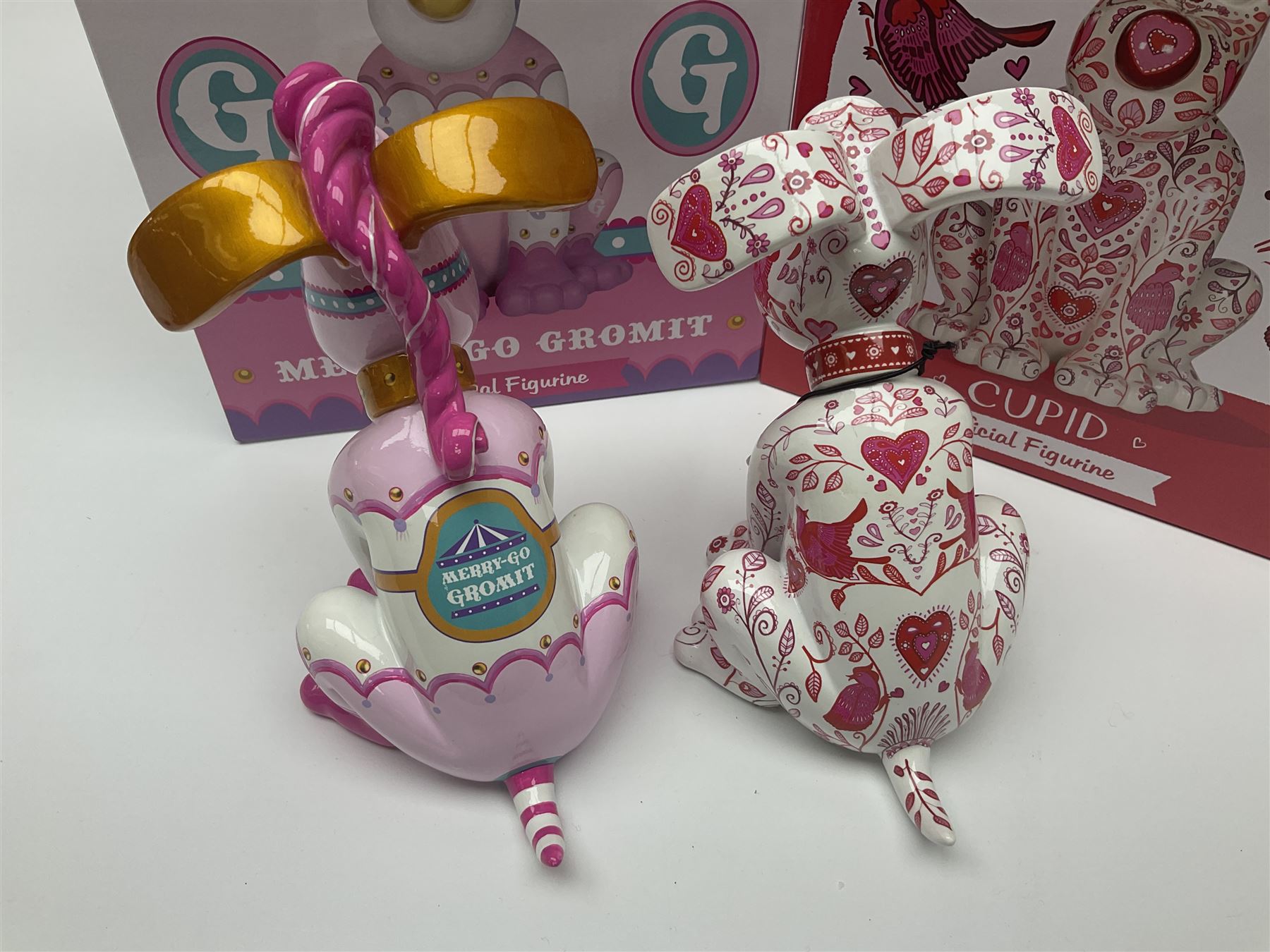 Wallace & Gromit - Gromit Unleashed: two Aardman Animations The Grand Appeal 'Gromit Unleashed' figures comprising Cupid and Merry-Go Gromit, both with boxes