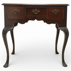 Early 20th century Irish mahogany lowboy, rectangular moulded top over three frieze drawers fitted with brass swan neck handles and escutcheons, shaped apron, raised on cabriole supports terminating in pad feet