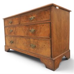 Traditional design walnut inlaid chest, with figured top with circular inlay and crossbanded top with moulded edge, figured drawers with cockbeaded edges and brass handles, raised on bracket feet