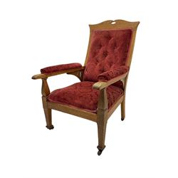 Early 20th century Arts & Crafts oak armchair, upholstered in red cover with raised foliate pattern