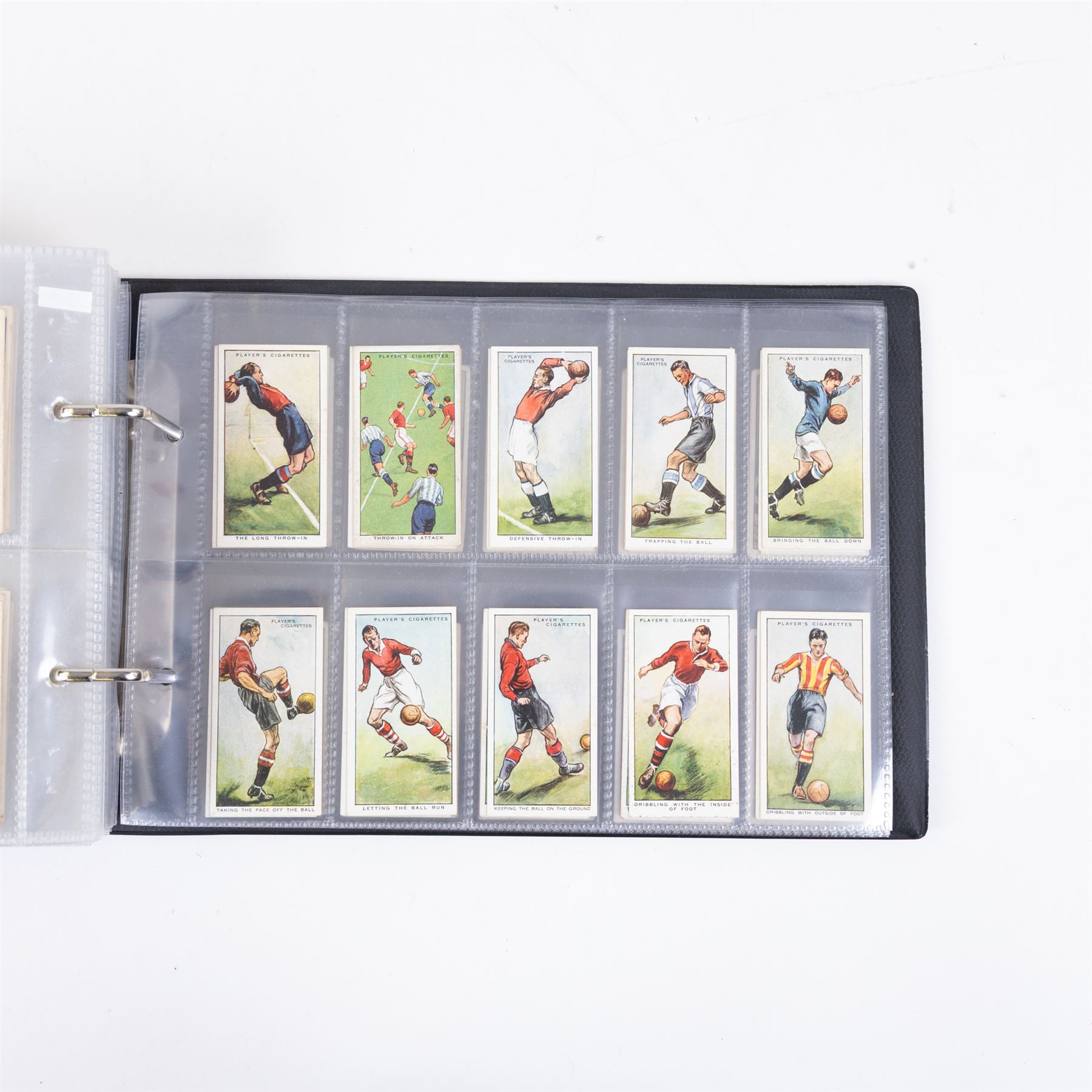 Collection of Edwardian and later Football related trading and cigarette cards, including forty-nine of fifty 1906 Ogden's Football Club Colours, 1922 PALS Footall series, ninety of one hundred 1925 Gallaher Famous Footballers, complete set of forty-four 1926 Ogden's Captains of Association Football Clubs and Colours, complete set of fifty 1927 Players Football Caricatures by MAC,  complete set of fifty 1927 Players Football Caricatures by RIP,  complete set of fifty 1930 Players Association Cup Winners, complete set of 50 1933 Ogdens AFC Nicknames etc, housed in brown cigarette card album
