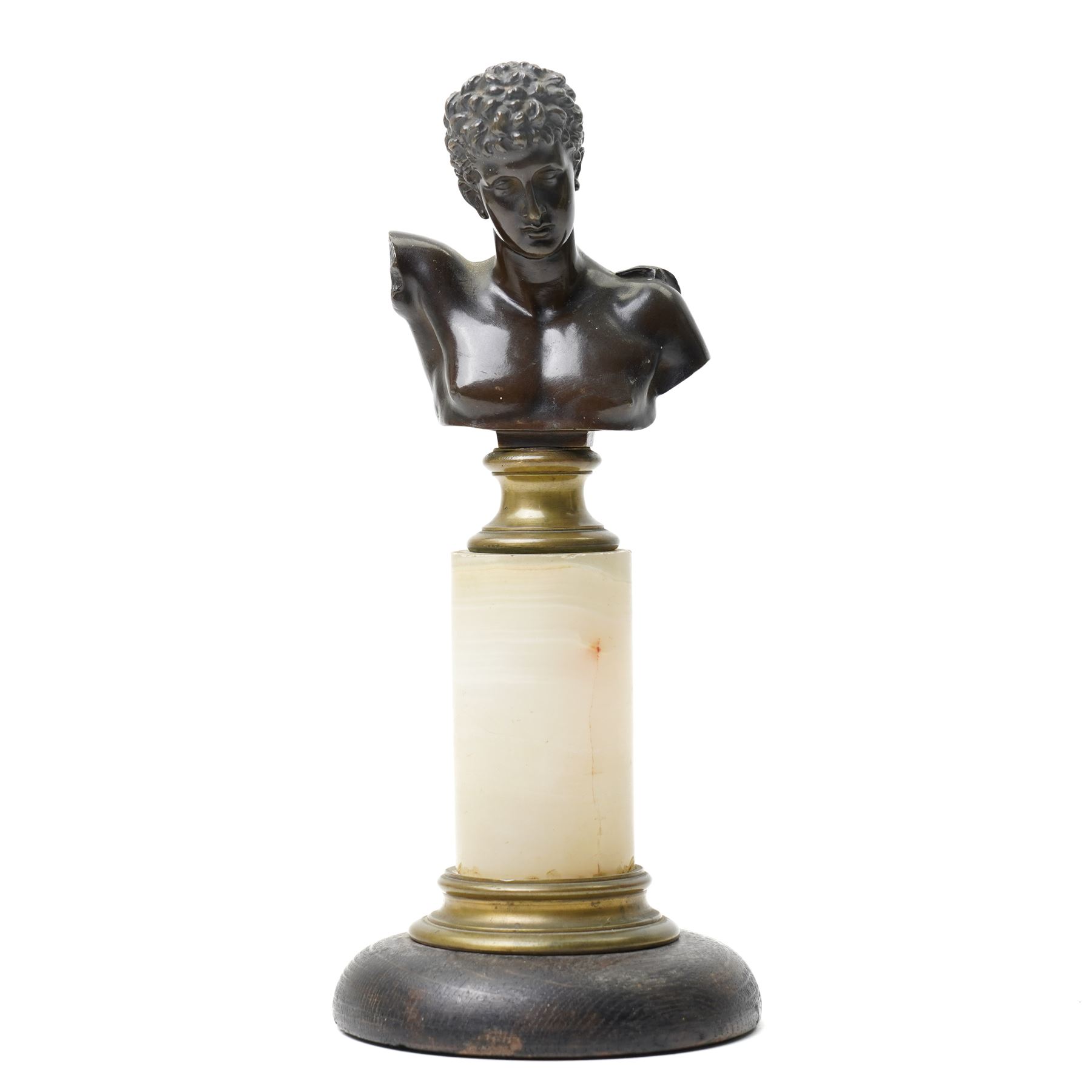 After the Antique - Eugen Börmel (Bormel) (German 1858-1932): a patinated bronze bust of Hermes, the youthful messenger of the gods modelled with idealised features and curling hair, the truncated torso mounted on a classical brass socle and cylindrical marble pedestal, signed to the reverse, H25.5cm