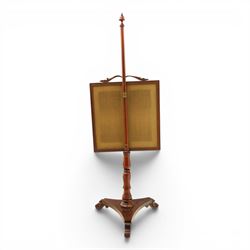 Two Victorian fire screens, comprising mahogany pole screen with glazed floral woolwork panel on turned support and triform base (H 142cm, W 48cm); and a larger carved walnut tapestry fire screen, glazed panel depicting a domestic interior scene, scroll carved cresting, barley twist uprights and turned stretcher base (H 75cm, W 49cm)