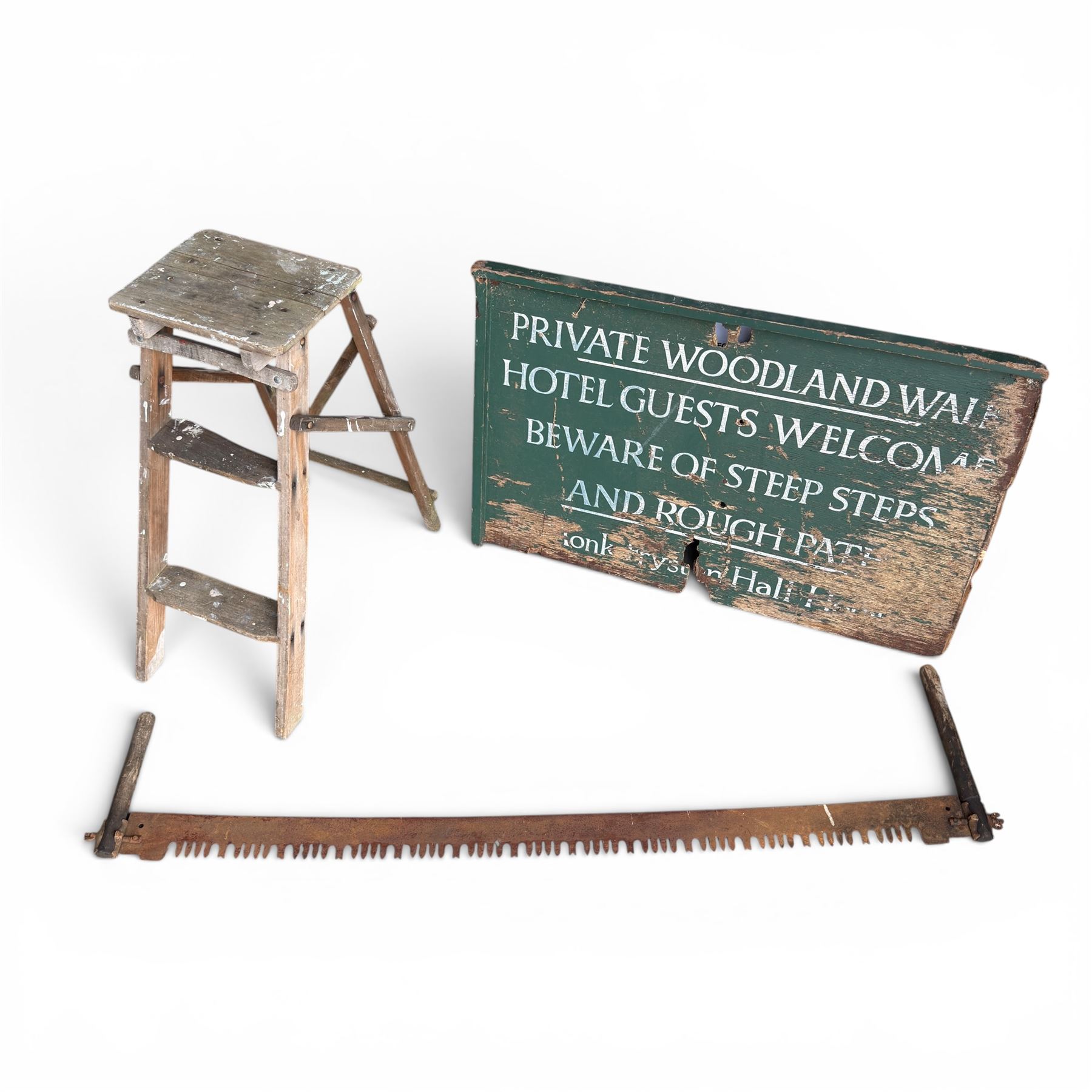 Private woodland walk wooden sign along with large saw and wooden step ladders