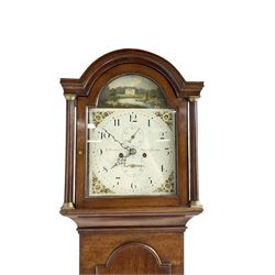 G Fortier of Sittingborn - Early 19th century 8-day mahogany longcase clock c1825, with a break arch pediment and hood door flanked by reeded pilasters with brass capitals, plain case with a long trunk door with a conforming break arch top, plinth with applied skirting, painted dial with upright Arabic numerals, date  and seconds dials, floral spandrels and a rural depiction of a country house and river to the arch, replacement steel hands with brass pointers to the calendar and seconds dials, dial pinned directly to a rack striking movement. With weights, pendulum and winding key.