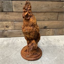 Small cast iron cockerell, on circular base