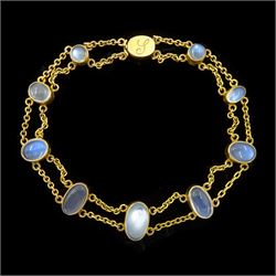 Early 20th century gold nine stone, graduating moonstone link bracelet, the clasp engraved...