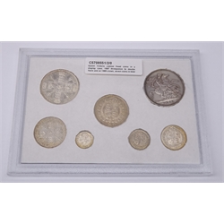  Queen Victoria Jubilee Head coins in a display case 1887 threepence to double florin and an 1889 crown, seven coins in total  